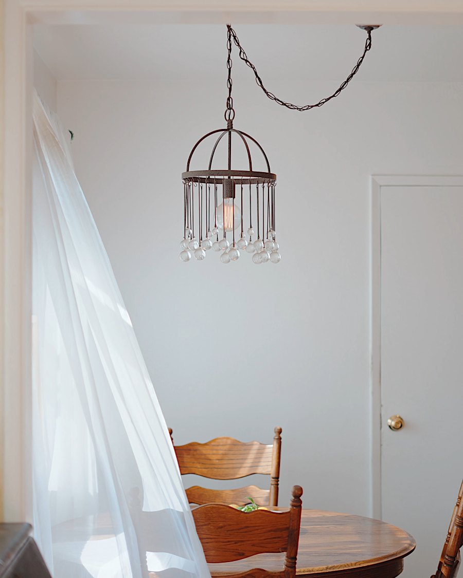 Chandelier and sheer curtains in the dining room at 750 Hillcrest St, El Segundo